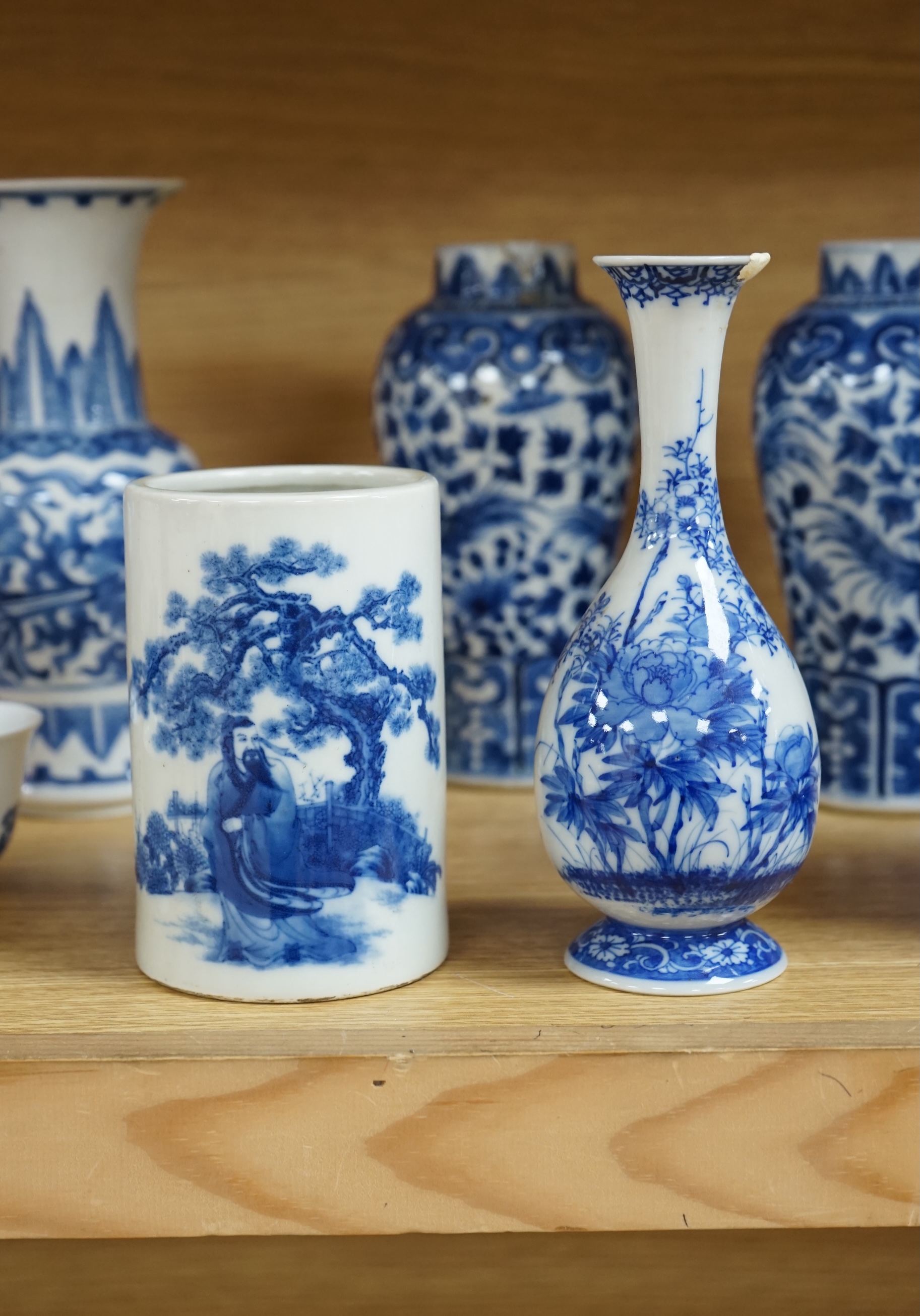 A collection of 19th and 20th century Chinese blue and white vases and tea bowls, largest 21cm high. Condition - varies, mostly poor